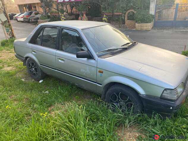 $1,500 Mazda 323 - $1,500 2