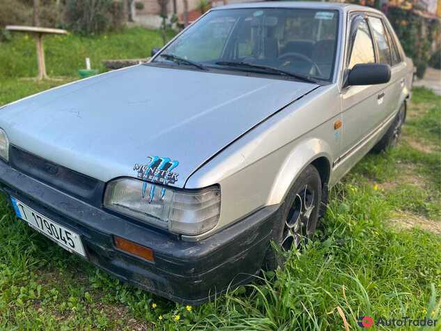 $1,500 Mazda 323 - $1,500 3