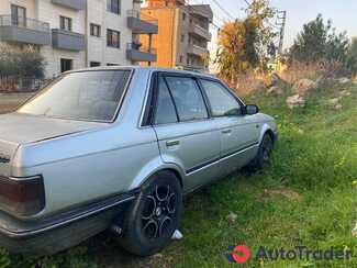 $1,500 Mazda 323 - $1,500 4